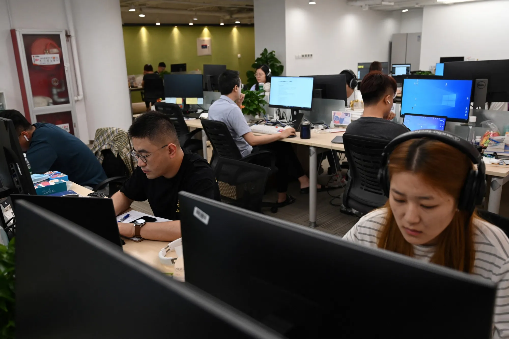 Beijing office workers at their computers.