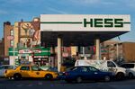 Cars pull in to refuel at a Hess Corp. gas station in the Brooklyn borough of New York.