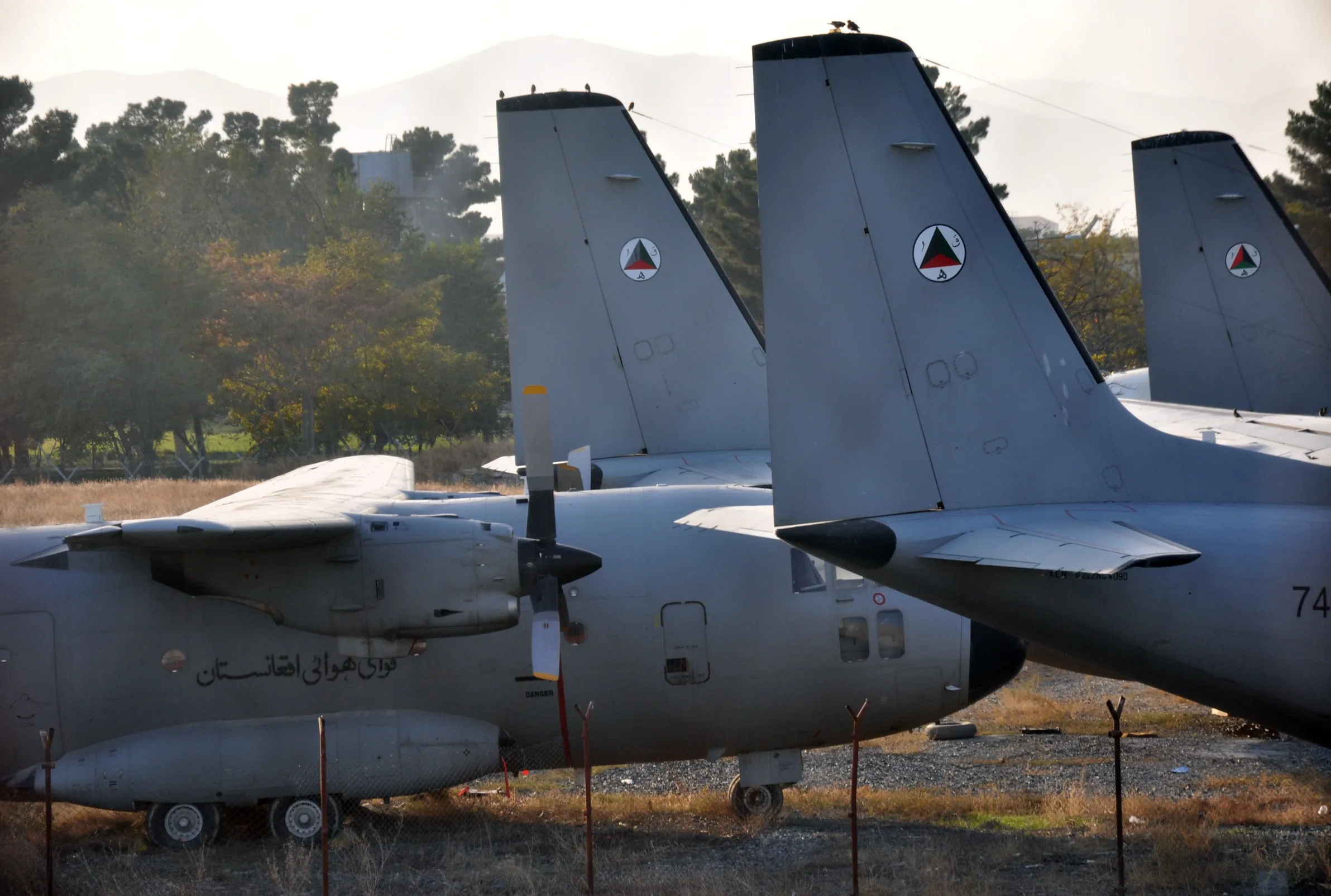 Broken-down G222 transport planes parked next to the runway at Kabul International Airport before they were scrapped.