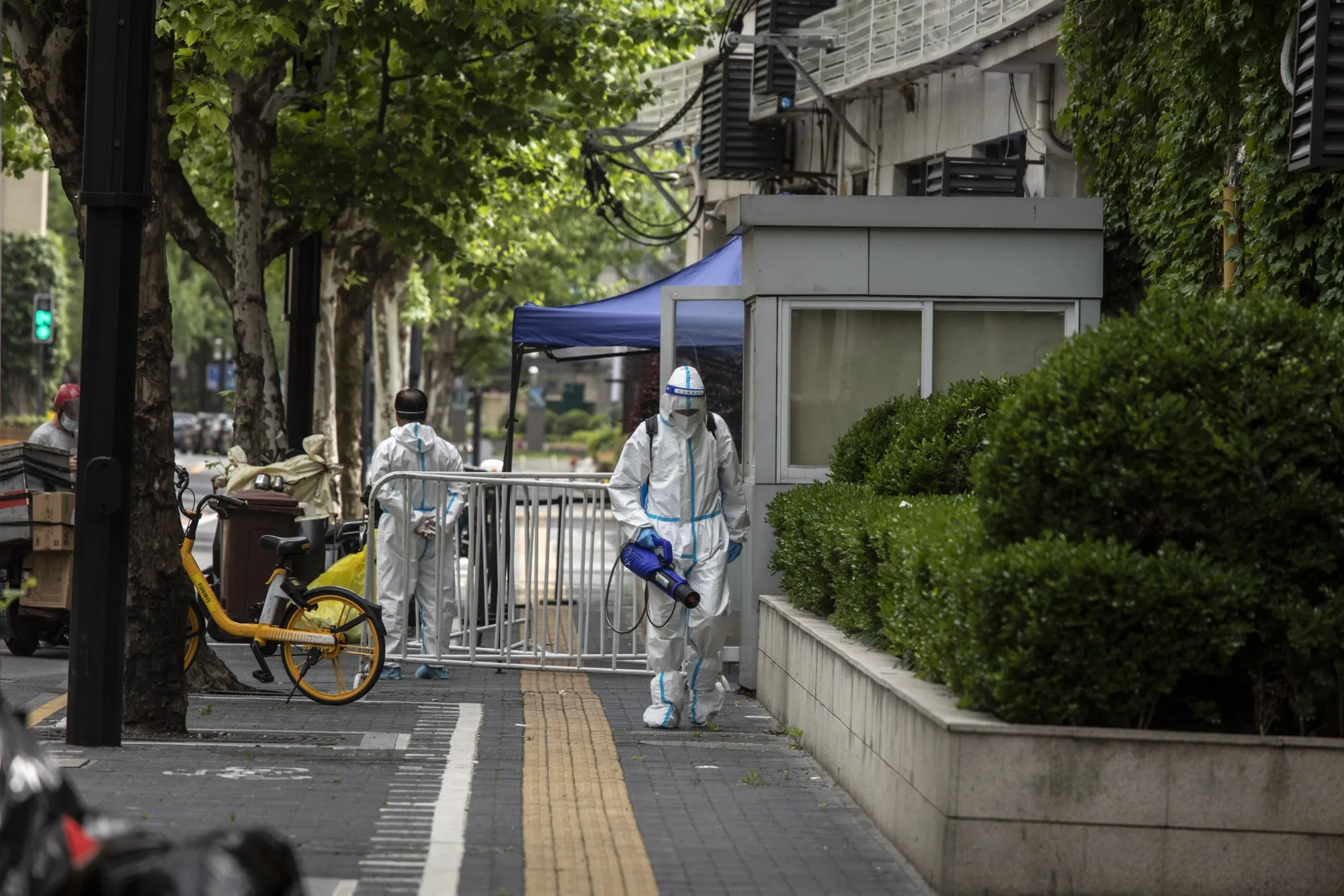 A volunteer sprays disinfectant during a lockdown in Shanghai on April 28.