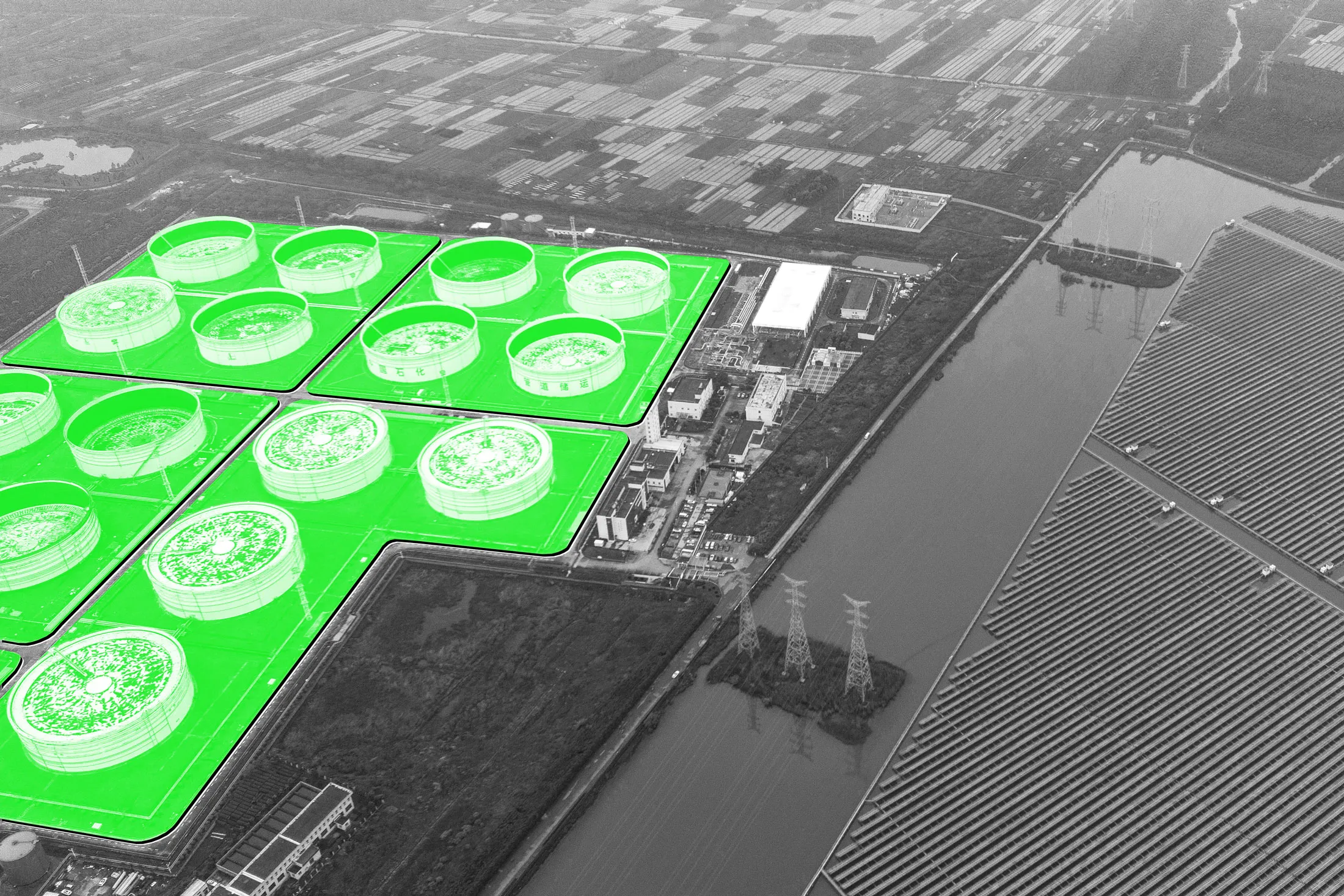 Oil storage tanks opposite a floating solar farm in Ningbo, in&nbsp;China’s Zhejiang province, on April 22.