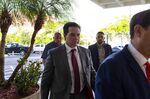 Craig&nbsp;Wright, self declared inventor of Bitcoin, center, arrives at federal court in West Palm Beach, Florida, U.S., June 28.