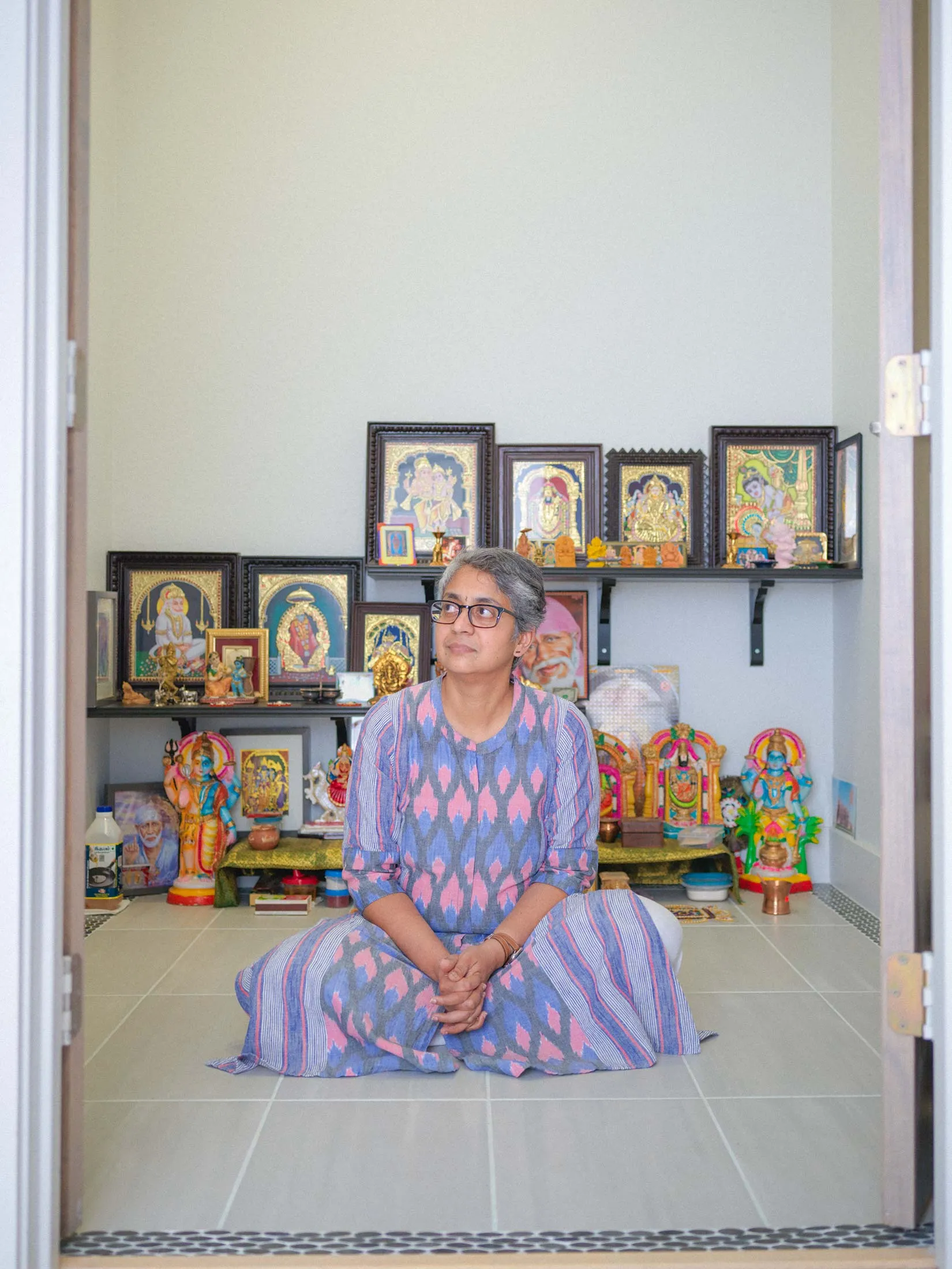 Sharadha Kodem in her home prayer room in Dallas, Texas.