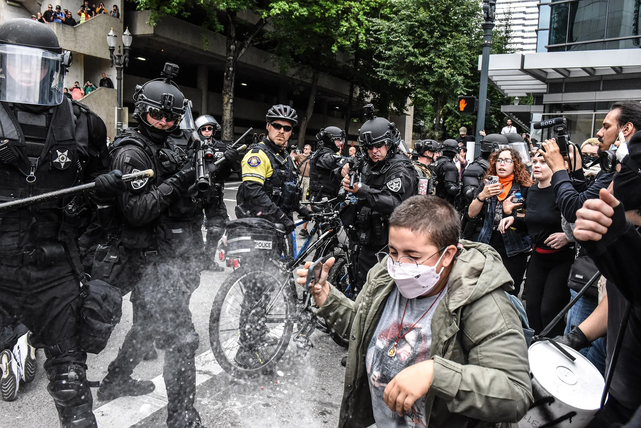 Portland police fire pepper spray rounds into a crowd of counter-protesters during an alt-right rally in Portland, Oregon, U.S.,&nbsp;on Sunday, Aug.&nbsp;17, 2019.