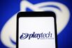 In this photo illustration, a Playtech plc logo of a