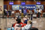 Passengers queue at check-in counters during strike action by EasyJet Plc and Ryanair Holdings Plc workers at El Prat airport in Barcelona, on&nbsp;July 1.