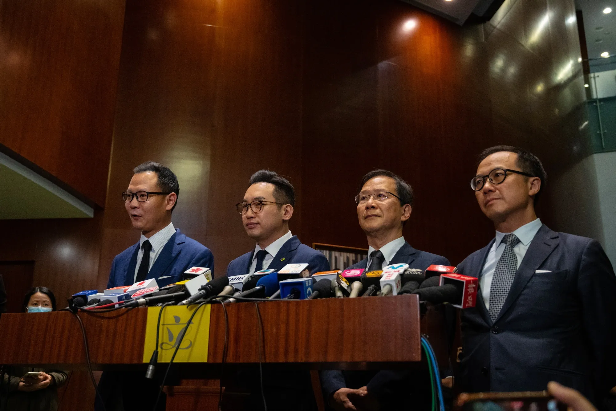 Opposition lawmakers Dennis Kwok, left, Alvin Yeung, Kwok Ka-ki and Kenneth Leung speak after being disqualified from the Hong Kong legislature on Nov. 11.