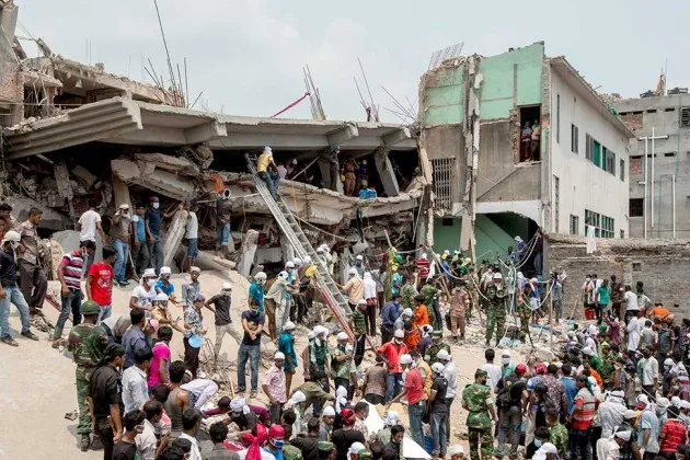 Rescue workers and volunteers search by hand for victims among the debris of the collapsed Rana Plaza building in Dhaka, Bangladesh, on April 26, 2013