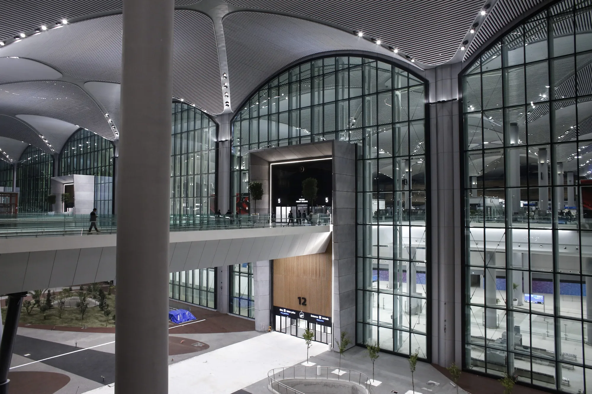 Visitors enter a terminal building during the&nbsp;opening ceremony for the new Istanbul Airport&nbsp;in 2018.