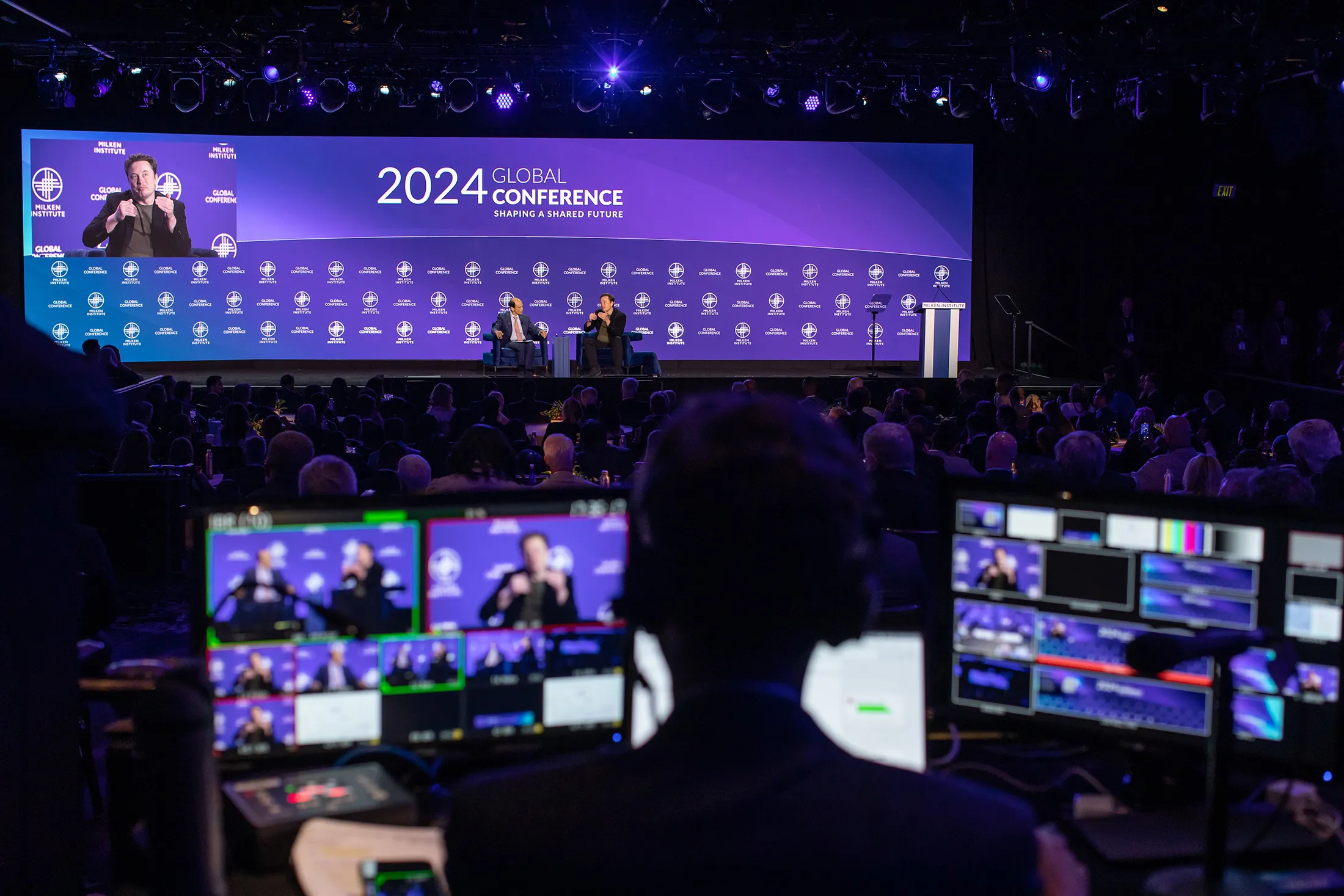 Michael Milken leads a conversation with Elon Musk on Monday.