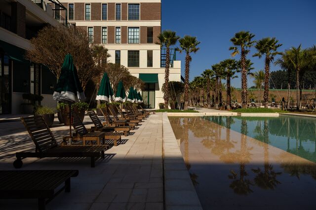 A pool area with lounge chairs at the Boa Vista Village.