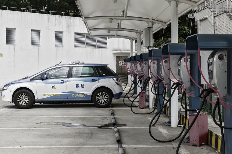 A BYD Co. E6 electric taxi is charged at the company's charging station in Shenzhen, China.