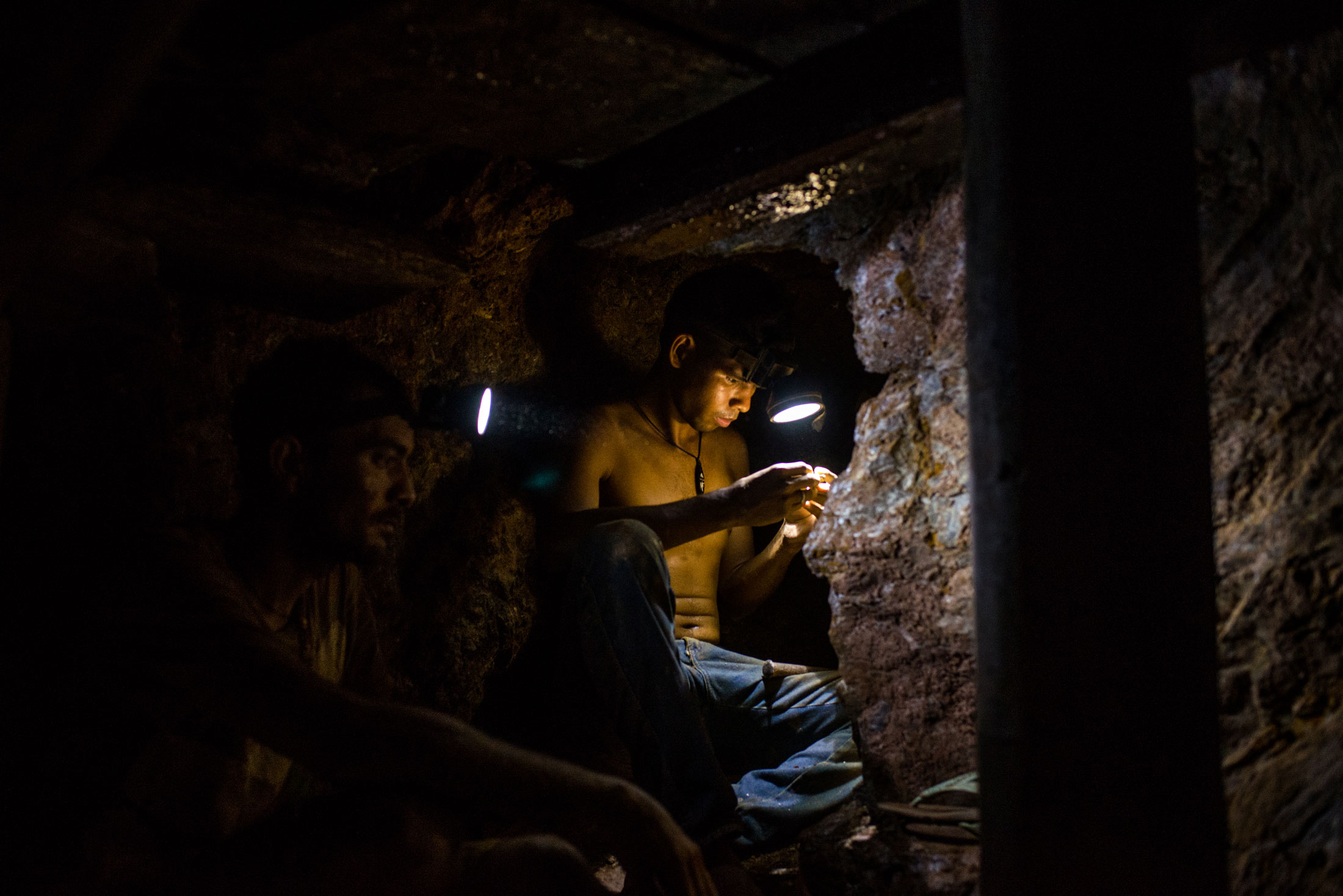 Miners work inside an underground mine in El Callao, Bolivar State, Venezuela on Feb. 27, 2018.