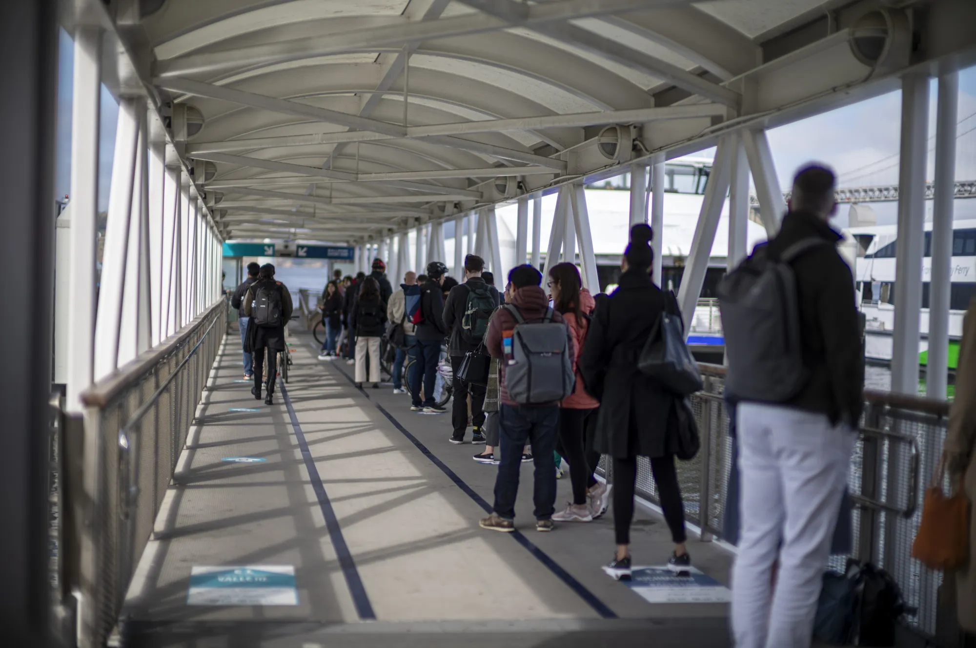 Commuters wait to board a ferry in San Francisco, California.