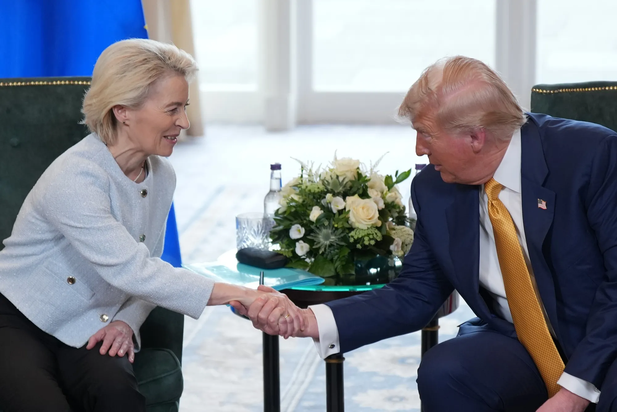 European Commission President Ursula von der Leyen, left, shakes hands with US President Donald Trump in Turnberry, Scotland, on July 27.