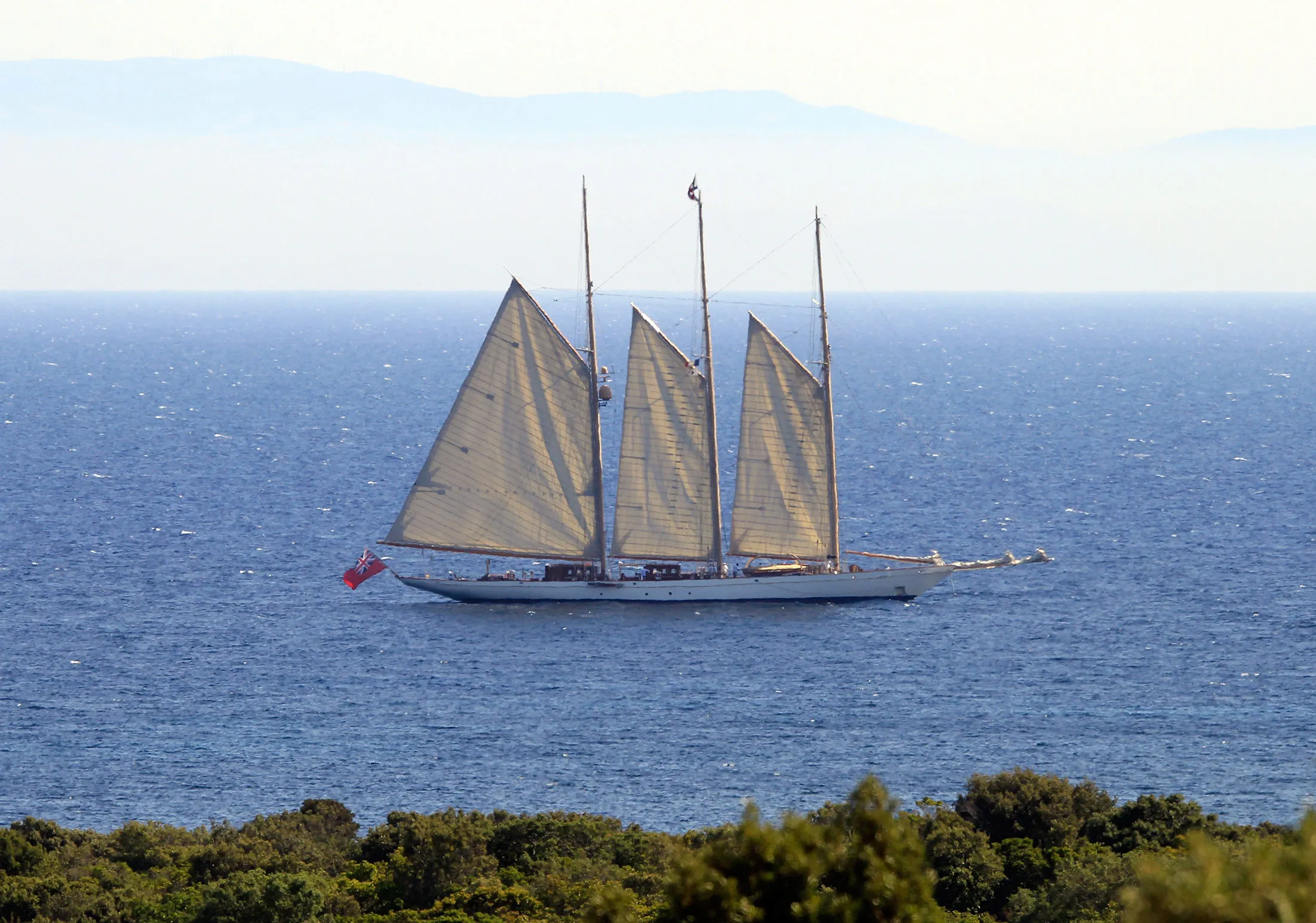 The yacht Adix, owned by Spanish Santander banking group and flying a British flag, sails off Testa beach on in Pianottoli Caldarello, Corsica, four days after French customs seized a Picasso on board.
