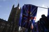 A British Union flag, also known as a Union Jack, flies beside a European Union (EU) flag during ongoing pro and anti Brexit protests outside the Houses of Parliament in London.