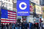 Monitors display Coinbase signage during the company's initial public offering (IPO) at the Nasdaq MarketSite in New York, U.S., on Wednesday, April 14, 2021.