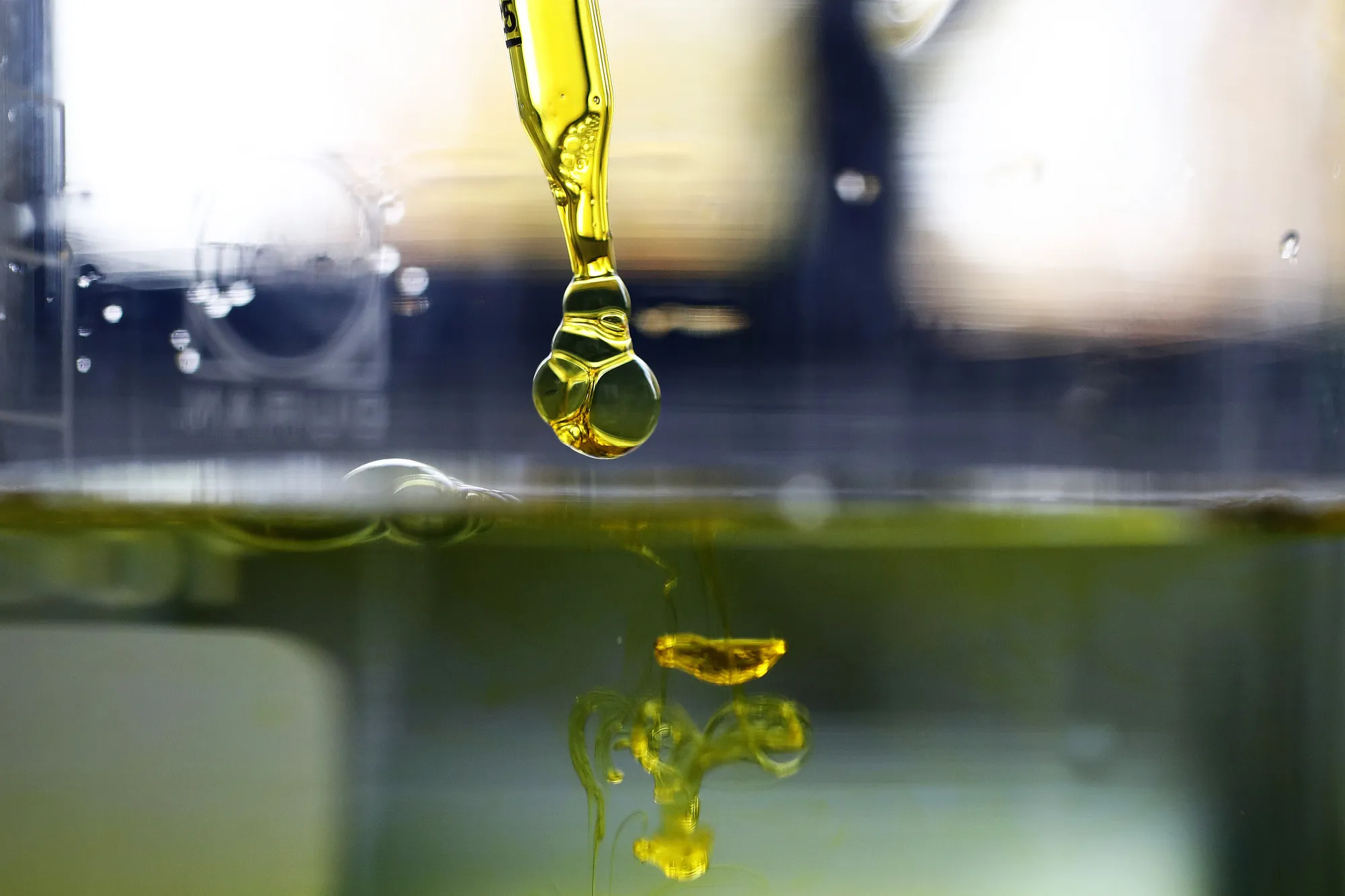 CBD&nbsp;oil is dropped into water inside a laboratory.