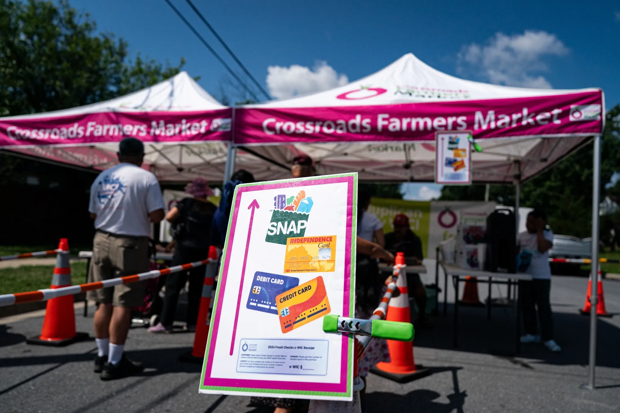 A sign advertising the acceptance of Supplemental Nutritional Assistance Program (SNAP) cards at a farmers market in Takoma Park, Maryland.
