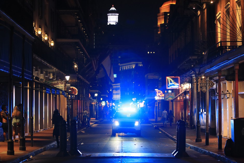 New Orleans police on Bourbon Street after the state ordered bars and restaurants to close.
