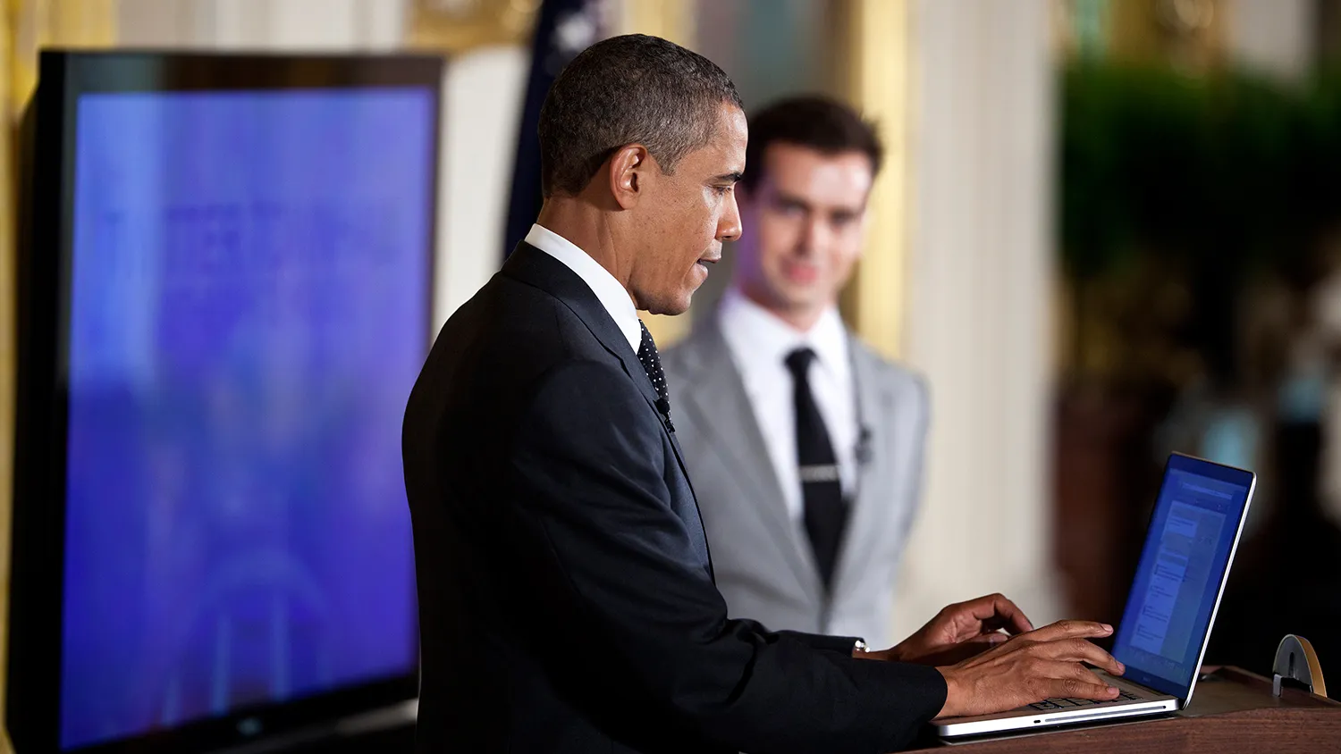 U.S. President Barack Obama posts a Tweet during an online Twitter town hall meeting from the East Room of the White House July 6, 2011 in Washington, DC.
