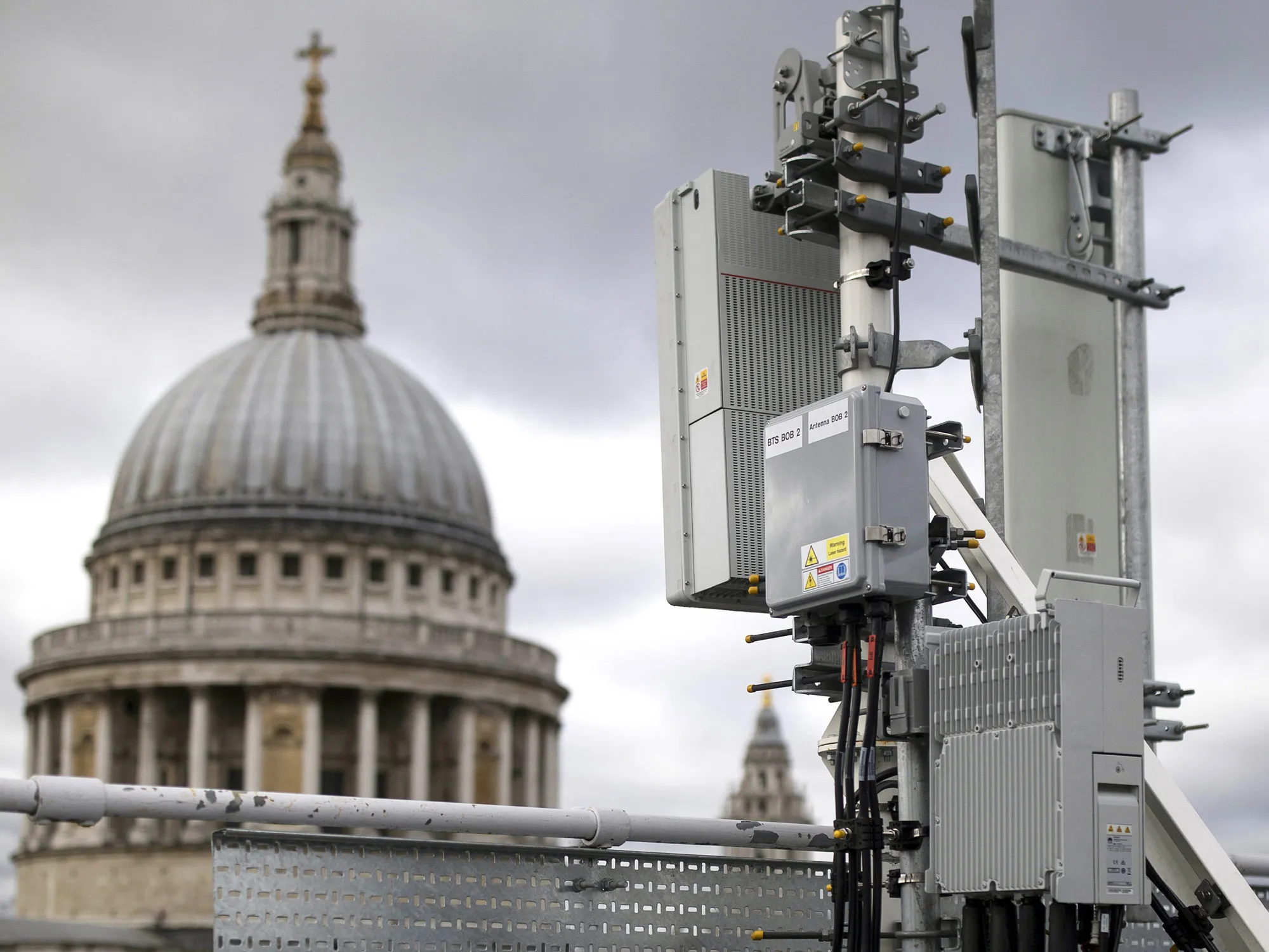5G masts including Huawei Technologies Co. 5G equipment, bottom right, installed on a rooftop overlooking St. Paul's Cathedral.