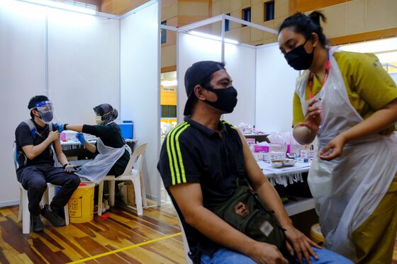 Malaysia Lowers Growth Forecast on Worsening Virus Outbreak