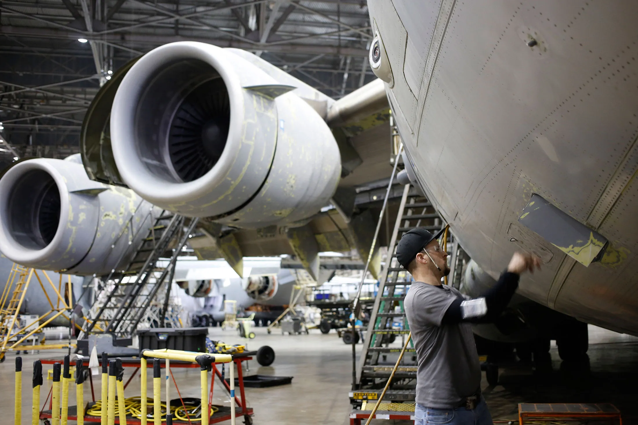 A technician inspects a U.S Air Force Boeing C-17 Globemaster III at the Boeing Global Services and Support facility in San Antonio, Texas.
