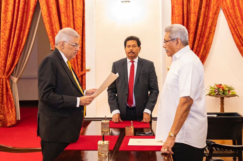 Ranil Wickremesinghe, left, is sworn in as Sri Lanka’s prime minister in front of President Gotabaya Rajapaksa, in Colombo, on May 13.