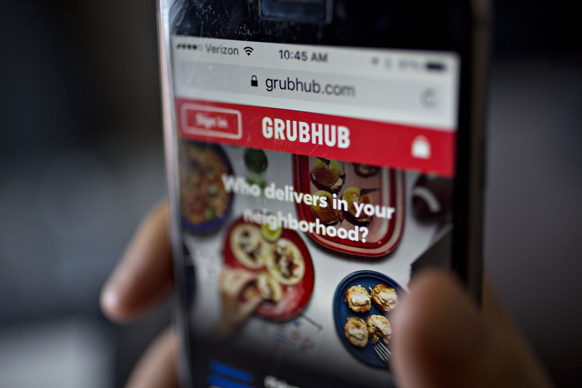 The GrubHub Inc. website is demonstrated for a photograph on an Apple Inc. iPhone in Washington, D.C., U.S., on Saturday, Feb. 4, 2017. GrubHub is scheduled to release earnings figures on February 8.