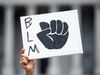 A demonstrator holds a Black Lives Matters sign during a protest against racism at the statehouse on June 6, 2020 in Columbia, South Carolina.