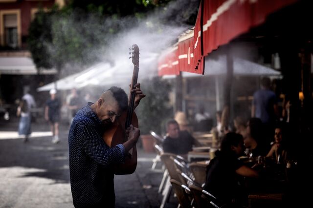 Mist sprayers are a popular way to keep diners cool in Seville's central district.