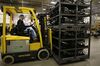 A worker moves parts used to assembled car seats at the Lear Corp. manufacturing facility in Hammond, Indiana.