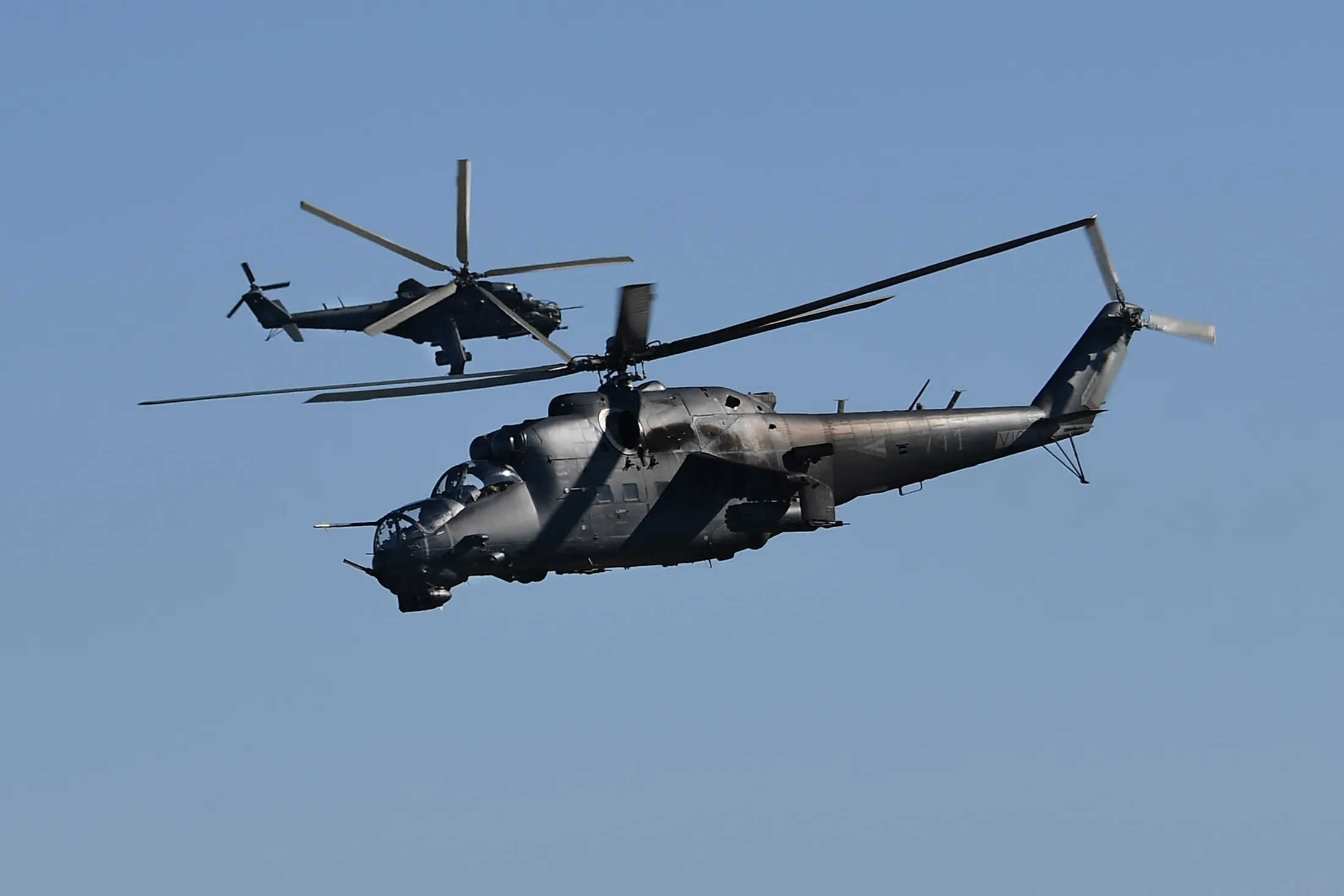 Hungarian army helicopters maneuver during a training exercise.