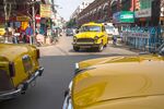 Taxis in the New Market area of Kolkata, West Bengal, India, on Nov. 1, 2013. Photographer: Sanjit Das/Bloomberg