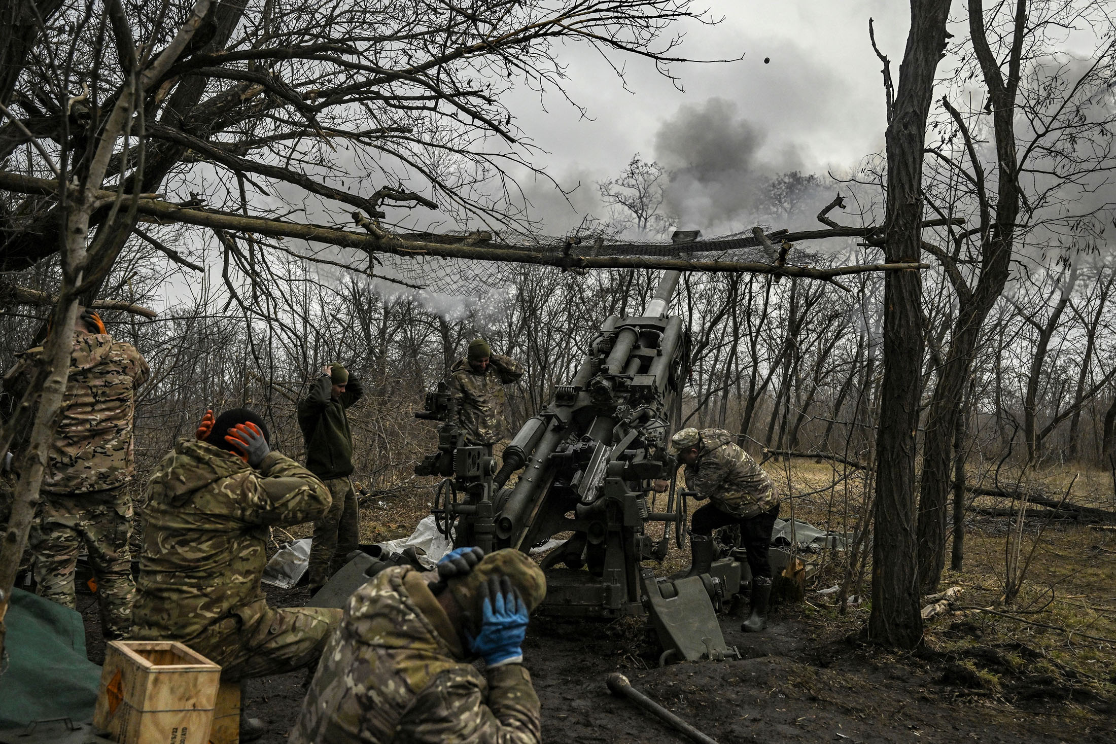 Ukrainian servicemen fire a 155mm M777 howitzer on the front line near Bakhmut, Ukraine.