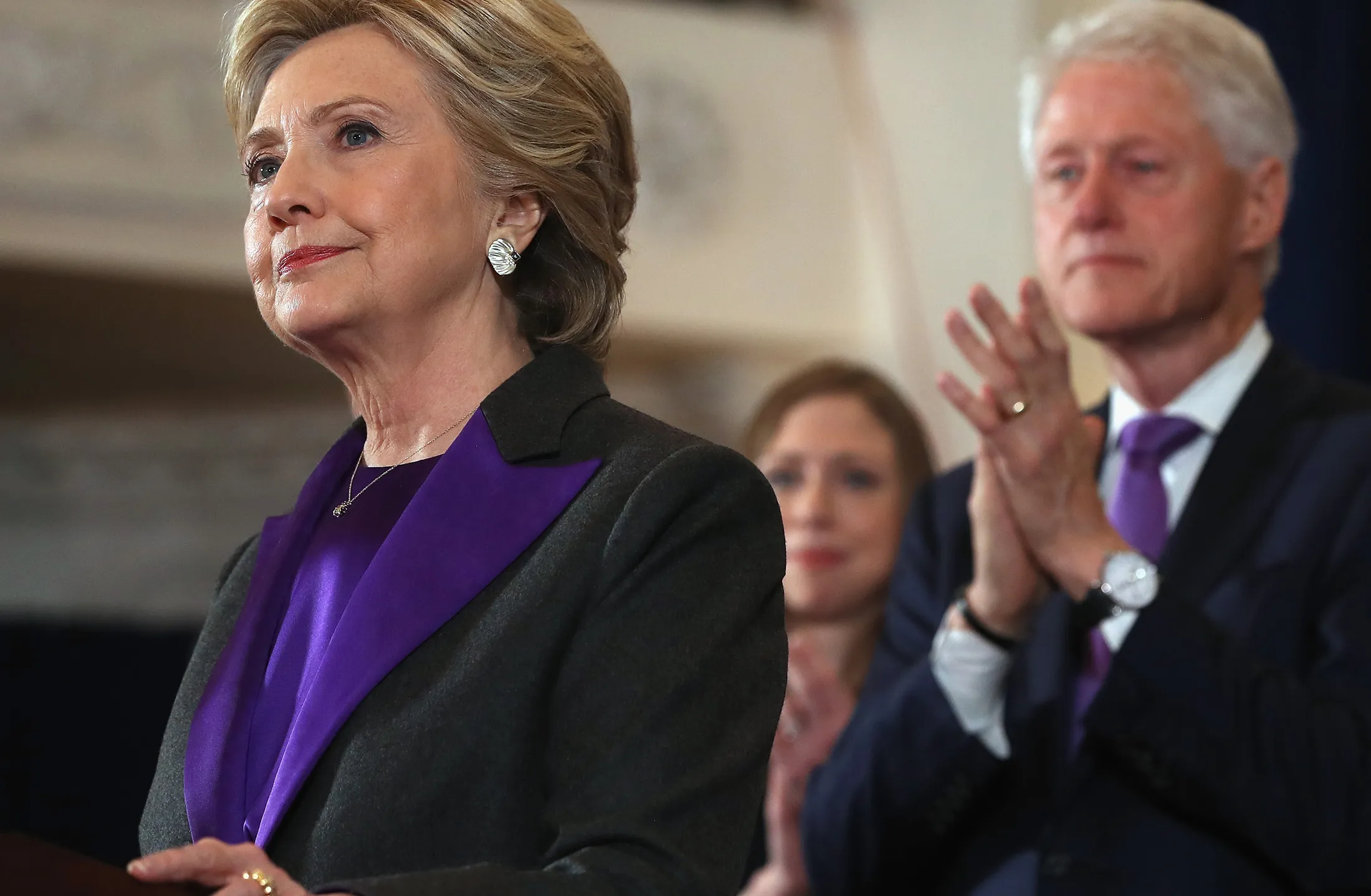 Hillary Clinton, accompanied by her husband Bill Clinton and daughter, Chelsea, concedes the presidential election in New York, on Nov. 9, 2016.
