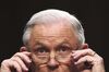 Attorney General Jeff Sessions puts on his glasses while testifying before the Senate Intelligence Committee.
