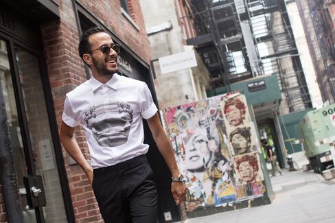 Moti walks through SoHo between shows and stops by the Mercer Hotel in a shirt by Neil Barrett and trousers by Theory.