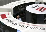 An employee works at the Tokyo Stock Exchange (TSE).
