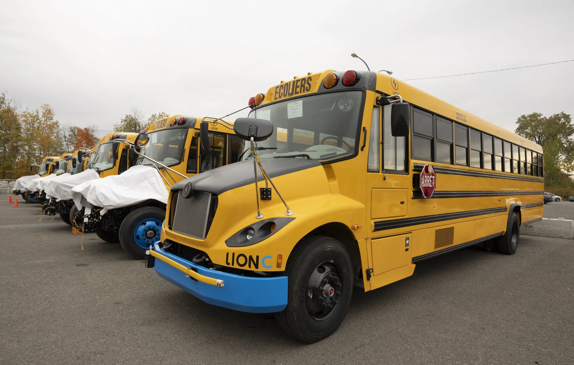 Lion C electric school buses outside the Lion Electric assembly plant in Saint-Jerome, Quebec, Canada.