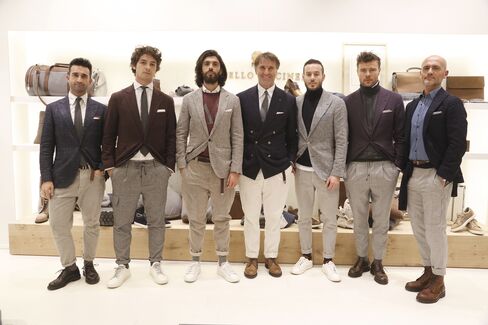 Italian designer Brunello Cucinelli, seen here with his brand ambassadors at his booth at Pitti, has a namesake line that is often considered one of the most aspirational aesthetics in menswear.