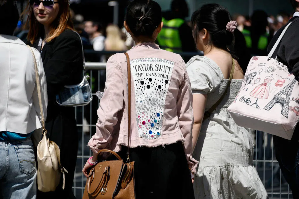 Fans of Taylor Swift arrive to the concert at the Paris La Defense Arena.