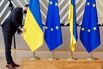 A Ukrainian flag next to EU flags in Brussels.