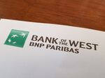 Close-up of logo for Bank of the West, a division of BNP Paribas, on a paper on a light wooden surface, May 11, 2018. (Photo by Smith Collection/Gado/Getty Images)