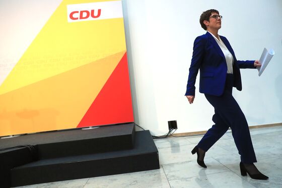 Merkel Role in Heir’s Exit Puts Her at Center of German Turmoil