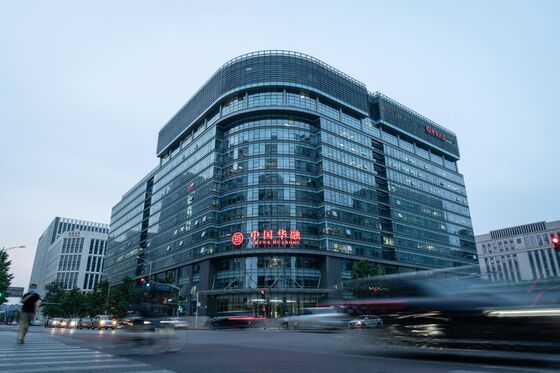 Inside the Race to Avert Disaster at China’s Biggest ‘Bad Bank’