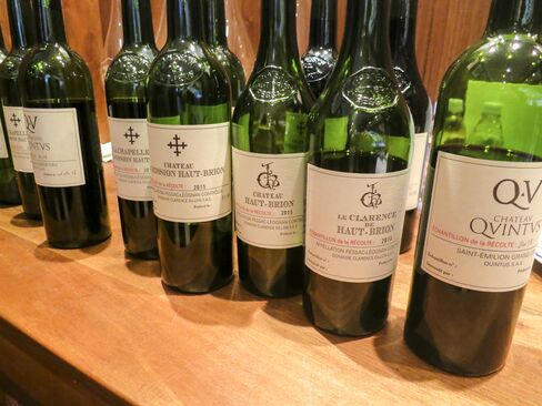 An array of bottled barrel samples from the 2015 vintage is displayed in the tasting room at Château la Mission Haut-Brion.