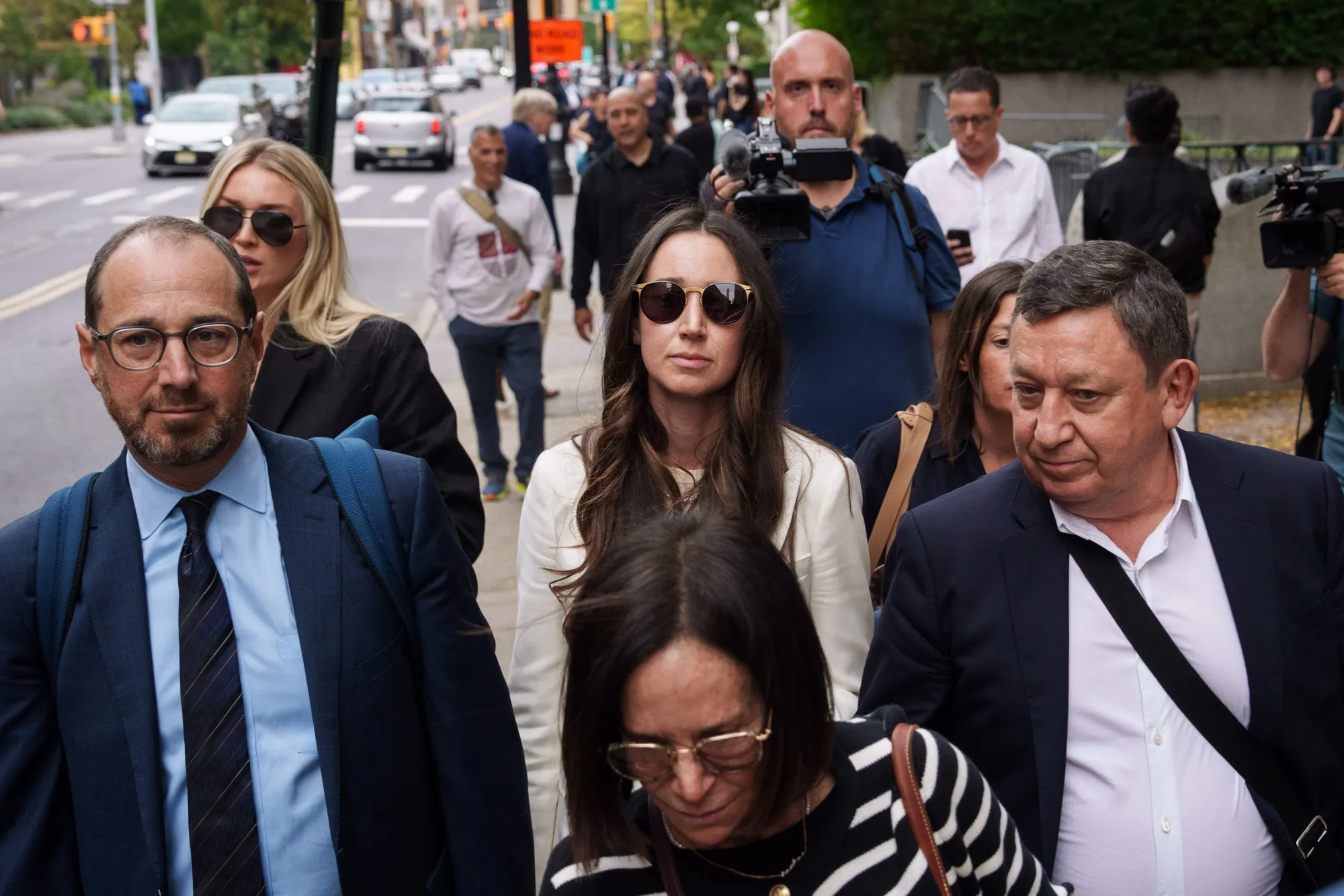 Charlie Javice, center, exits federal court in New York in September.